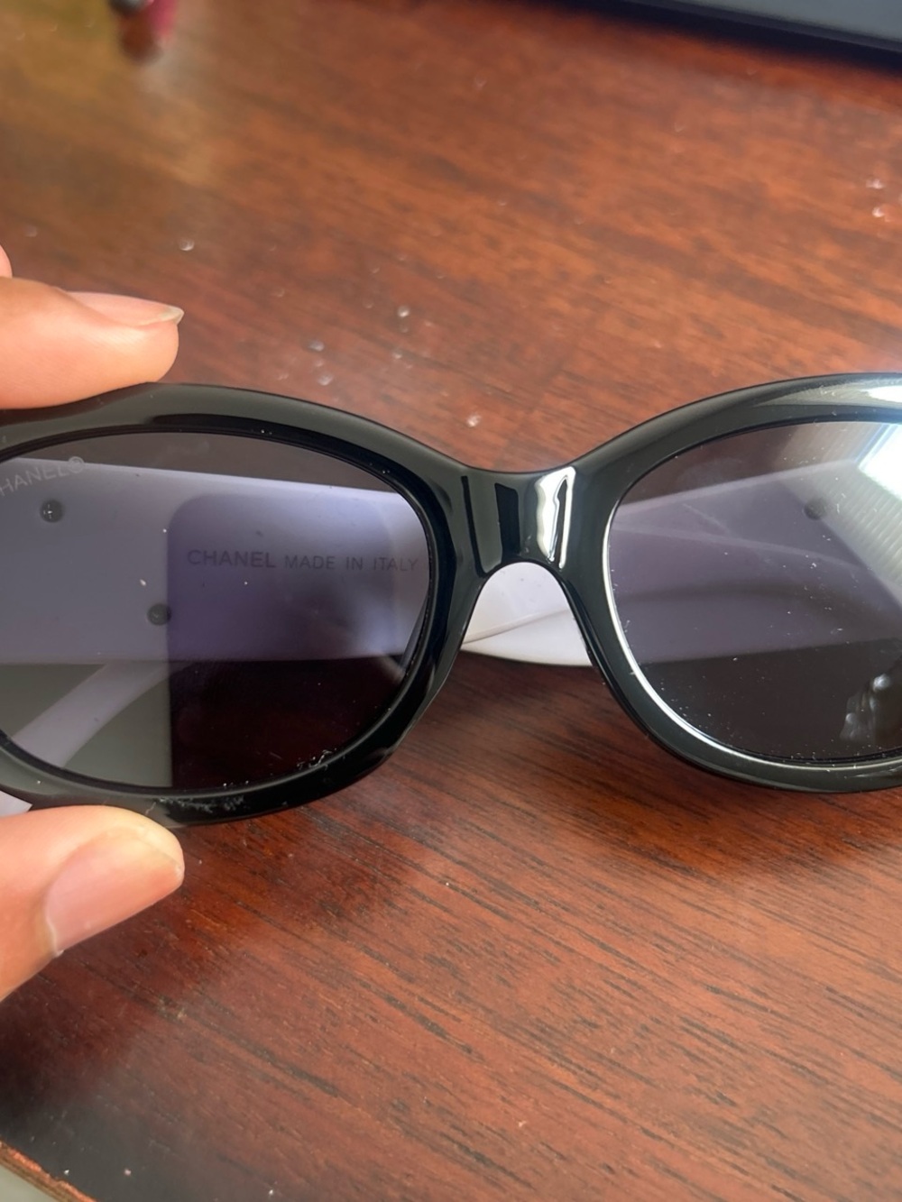 CHANEL Black Oval Women's Sunglasses with Dark Lenses